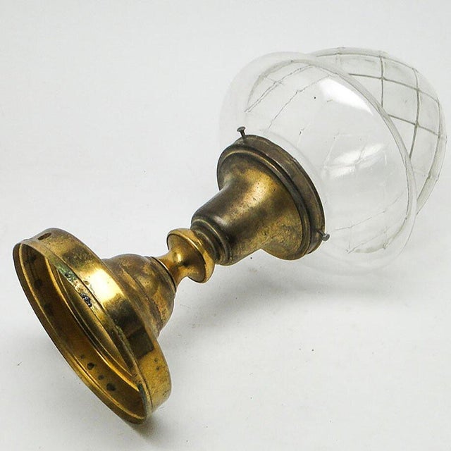 The pendant lamp was produced at the beginning of the twentieth century. The construction is made of brass, lampshade. It...