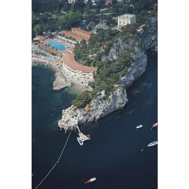 Roquebrune-Cap-Martin 1981 by Slim Aarons Slim Aarons Limited Estate Edition The Monte-Carlo Beach Hotel on the Pointe de...