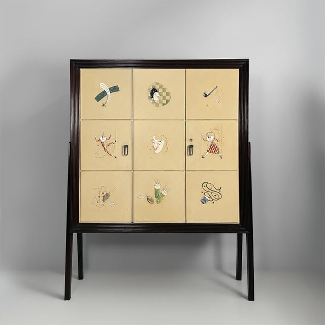Italian mid-century modern wooden bar cabinet, 1950s Bar cabinet with a dark wood structure. The front is composed of nine...