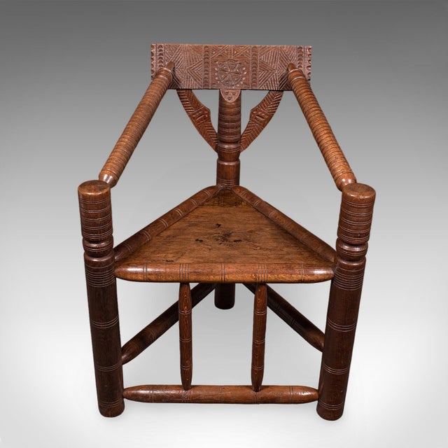 This is an antique turner’s armchair. An English, oak John Starkey 'Warwick' style elbow seat, dating to the late...