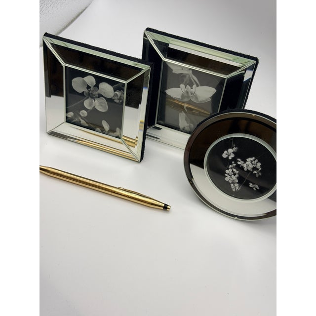 A sculptural set of mini mirrored picture frames by Restoration Hardware. The frames are freestanding and ideal for...