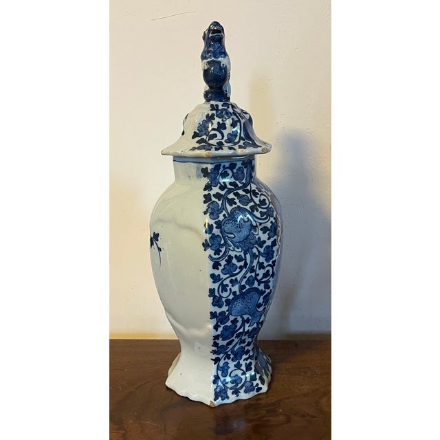 Antique 18th century Delft vase with figural lion lid in the Chinoiserie style decorated with an overall pattern of...