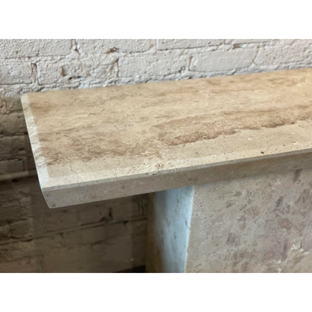 Very cool and understated travertine console/sofa table. The colors are beige with taupe veining in a beautiful honed...