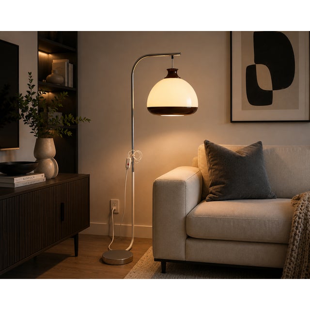 A distinctive Hungarian Space Age floor lamp dating from the 1970s, featuring a striking white and brown acrylic globe...