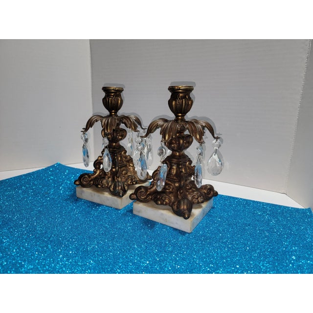 Lovely pair Hollywood Regency style candle holders / candlesticks. Having single candle holder with seven arms that have...