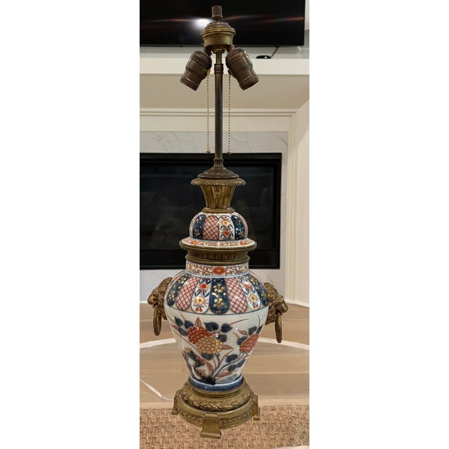 A Japanese Arita porcelain jar and cover dating from around 1870 that was later turned into a table lamp in the early 20th...