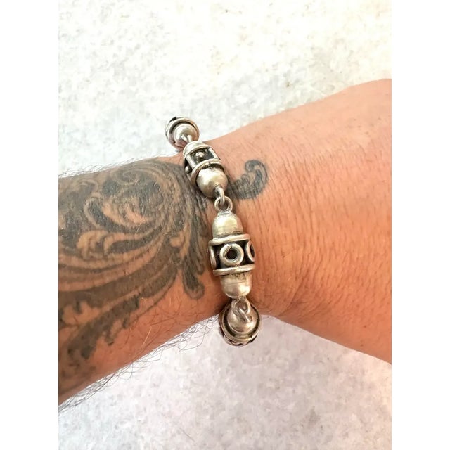 Los Ballesteros Taxco sterling silver beaded wrap bracelet with 50 gram, half inch wide beads. Bracelet is 8” long. The...