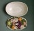 An amazing faux fruit garden basketweave ceramic dish in very good overall condition with a colorful variety of flowers...