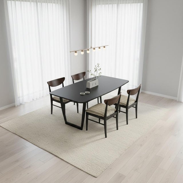 A striking, professionally restored 5-piece dining suite consisting of one rectangular boat-shape dining table and four...