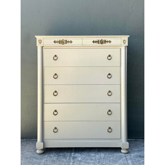 Make a sophisticated statement in your home with this exceptional vintage tall chest, showcasing a masterful blend of...