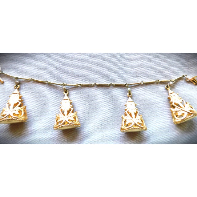FOBulous Openwork Art Deco Vintage Gold Four Charm Watch Fob Bracelet has a bar chain, toggle bar and lobster claw...