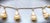 FOBulous Openwork Art Deco Vintage Gold Four Charm Watch Fob Bracelet has a bar chain, toggle bar and lobster claw...