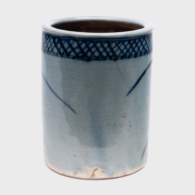 Set alongside the four treasures of the study - the calligraphy brush, ink, paper, and inkstone - a brush pot was a...