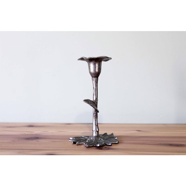 This vintage flower-shaped candle holder embodies the sculptural aesthetic of the 1970s. Crafted from pewter, its organic...
