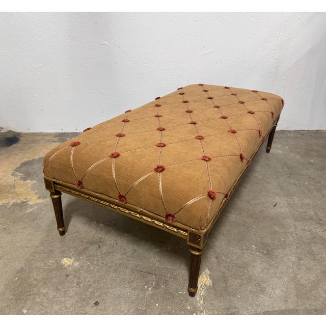 This elegant French Louis XVI giltwood bench showcases the refined craftsmanship and timeless beauty of neoclassical...