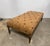This elegant French Louis XVI giltwood bench showcases the refined craftsmanship and timeless beauty of neoclassical...