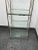 Design Plus Gallery presents a Chrome Campaign Style Etagere of Vintage Age. The chrome frame is cross hatched on the...