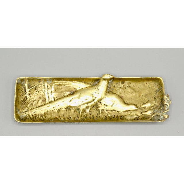 Circa 1890, nice quality French gilded bronze pen tray. It is well cast solid bronze with detail and depicts several...