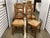 Great set of 4 French pine chairs. Very sturdy, these chairs feature tall backs and rush seats without stains or damage....
