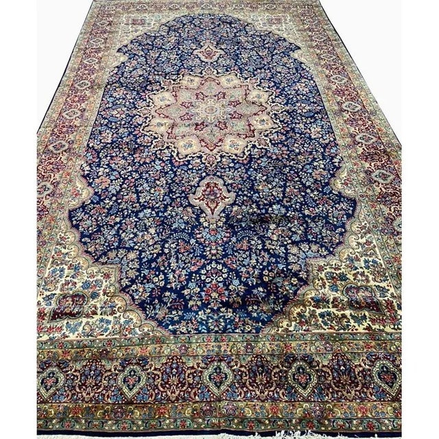 ACTUAL SIZE: 11’11” x 19’9″ PRIMARY COLOR: Navy / Red AGE: Old MATERIALS: Wool FOUNDATION: Cotton PRODUCTION: Handwoven,...