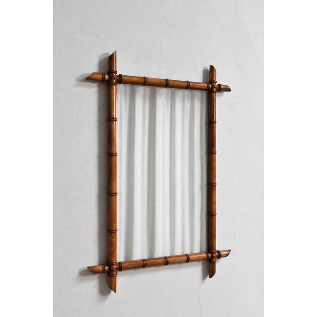 Pair of wooden faux bamboo mirrors, 1920s. Height: 86 cm - 33.86 in Length: 62 cm - 24.41 in Width: 3 cm - 1.18 in