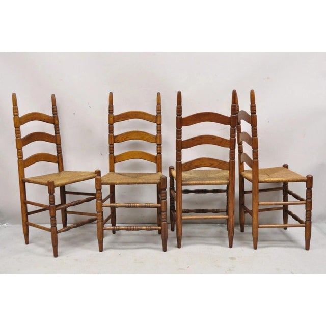 Antique Ladderback Primitive Rustic Oak Wood Rush Seat Dining Chairs - Set of 4. Set features a nice smaller size, turn...