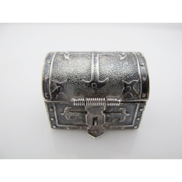 Vintage Mexican wedding chest. Miniature hinged lid chest in sterling silver with red lined interior. Has loops at each...