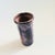 A vintage studio pottery vase with a purple drip glaze. Nice cylinder shape with a ribbed texture. Measures 3.5"Dia x 7"H