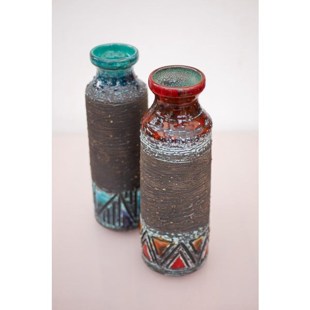 A large pair of ceramic vases by Tilgmans, Sweden. Tilgmans is celebrated for its masterful use of graffito decoration, a...