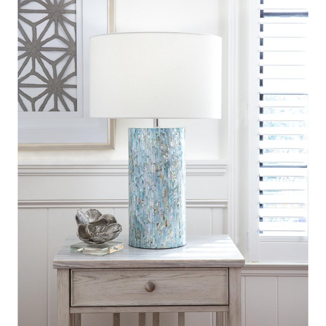 Like the shimmering light of the sun atop water, Layla's azure blue, mother of pearl tiles create the same dazzling...