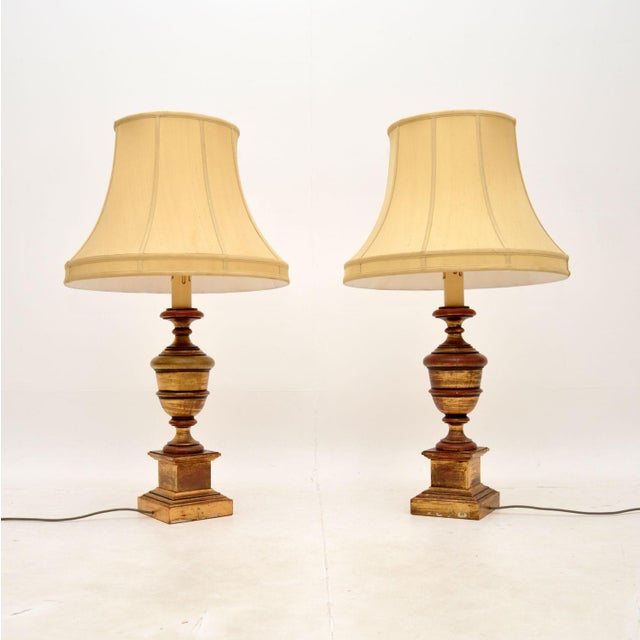 An absolutely stunning, large and impressive pair of antique gilt wood table lamps. They were made in England, they date...