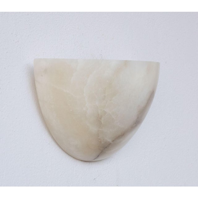 Antique alabaster wall lamp in Art Deco style, circa 1950s. A single piece of alabaster, beautifully worked with shades...
