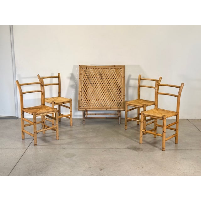 Bamboo dining set consisting of a folding table and 4 chairs with straw seats (87h.x44x45 h.seat 46 cm.), closed table...