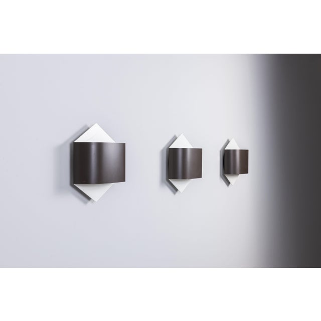 This striking set of three model 2010 wall lamps by Rolf Krüger and Dieter Witte for Staff Leuchten is a beautiful example...