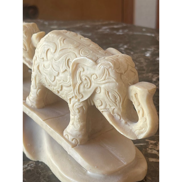 Vintage family of Elephants, bridge-carved resin sculpture.