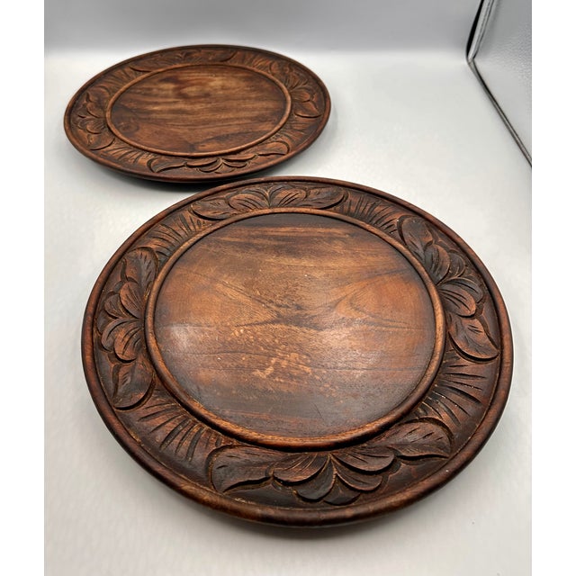 Beautiful antique hand-carved wooden bread board, likely early 1900s. Features a carved floral border around the rim a...