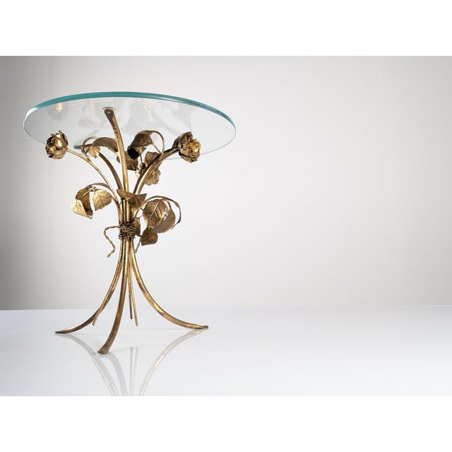 This accent side table reflects the Hollywood Regency and Mid-Century Modern aesthetic of the 1970s, characterized by its...