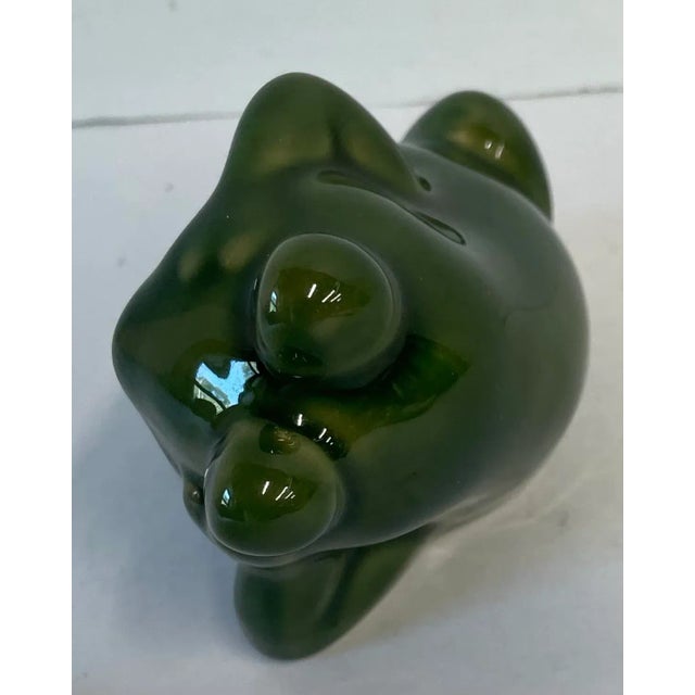 Love this cute little ceramic frog figurine with a worried look!