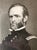 A framed presentation piece featuring a portrait of Civil War General William Tecumseh Sherman, accompanied by a mounted...