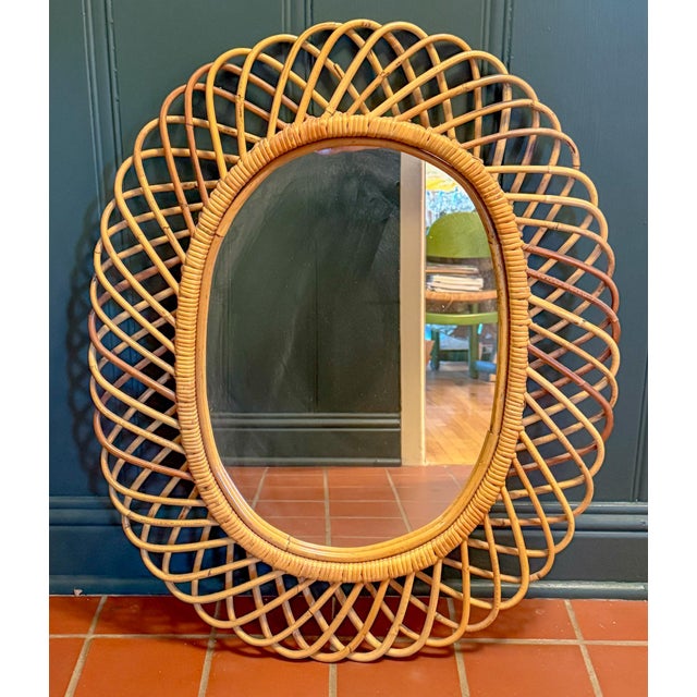 Incredible Italian wicker rattan wall mirror by the designer Franco Albini, by Rosenthal-Netter, circa mid-20th century,...