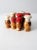 Collection of eight vintage wooden salt and pepper shakers, circa 1950, each hand-painted with playful chef designs. The...