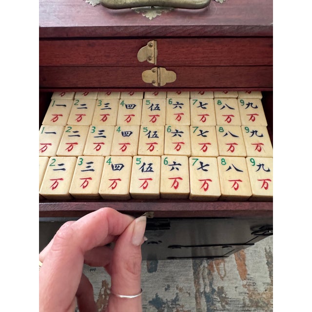 Beautiful antique 1920’s Mahjong set with bamboo backed bone tiles and markers. Bought by my grandmother in the 70’s at an...