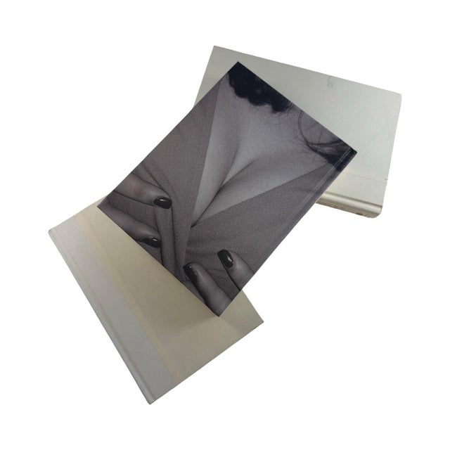 A crisp, neutral trio of white and ivory hardback books perfect for adding a clean and modern touch to any bookshelf or...