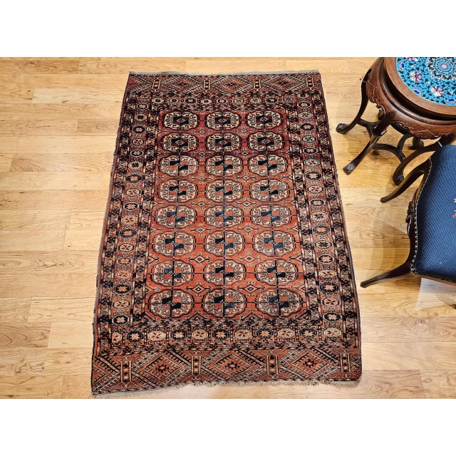 3’ 8” x 5’ 3” Vintage Turkmen Tekke area rug in an allover small medallion pattern from the early 1900s. The rug has a...