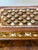 Beautiful small brown cowrie sea shells encrusted jewelry box in two tiers laid out with velvet.