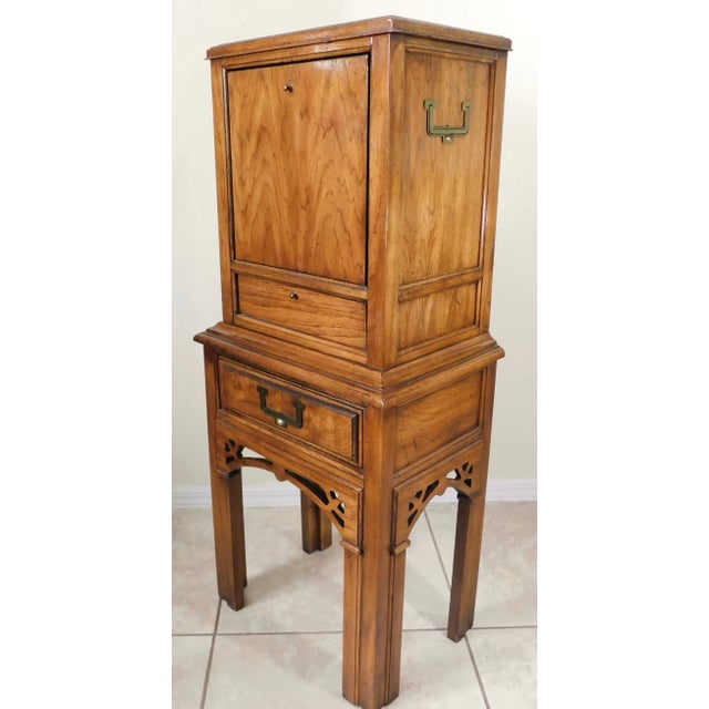 Lovely petite vintage mid century campaign oak wood storage cabinet. Sweet piece! Top opens with a couple of small cubby...