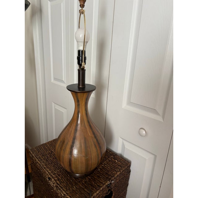 Slender brown MCM-style table lamp with a distinctive bulbous, vase-like ceramic base.