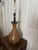 Slender brown MCM-style table lamp with a distinctive bulbous, vase-like ceramic base.