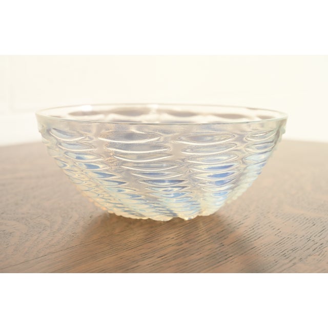 A gorgeous Art Deco period glass bowl featuring a beautifully molded opalescent concentric wave design By René Lalique...