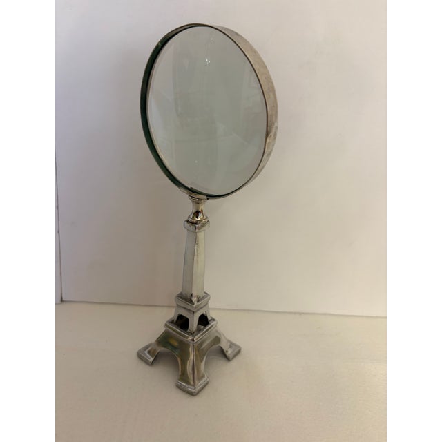 Add a touch of Parisian flair to your workspace or library shelves with this unique tabletop magnifying glass. Serving as...